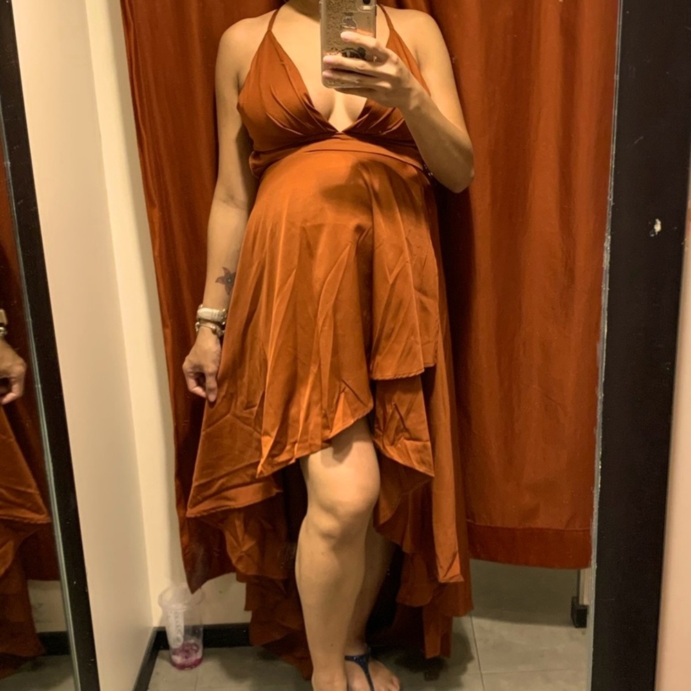 NWT High low dress. Adjustable back.